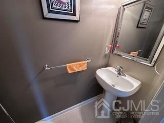 5 Saxton Road Farmingdale, NJ 07727 - Photo 14 of 39 a bathroom with a sink and mirror
