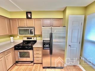 5 Saxton Road Farmingdale, NJ 07727 - Photo 16 of 39 a kitchen with granite countertop a refrigerator and a stove top oven