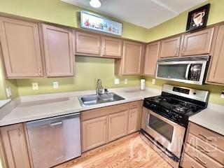 5 Saxton Road Farmingdale, NJ 07727 - Photo 17 of 39 a kitchen with stainless steel appliances granite countertop a sink stove and cabinets
