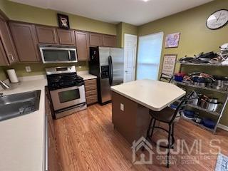 5 Saxton Road Farmingdale, NJ 07727 - Photo 21 of 39 a kitchen with stainless steel appliances a stove a refrigerator and a refrigerator