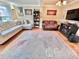 5 Saxton Road Farmingdale, NJ 07727 - Photo 23 of 39 a living room with furniture and a flat screen tv