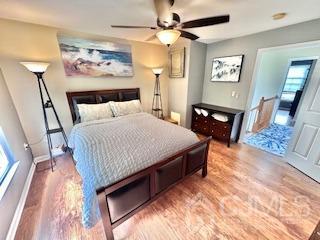 5 Saxton Road Farmingdale, NJ 07727 - Photo 36 of 39 a bedroom with a bed and a chandelier