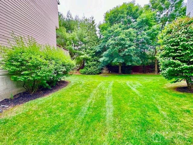 5 Saxton Road Farmingdale, NJ 07727 - Photo 4 of 39 a view of a backyard with a garden