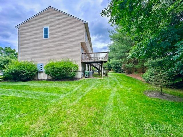 5 Saxton Road Farmingdale, NJ 07727 - Photo 5 of 39 a front view of a house with a yard