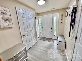 5 Saxton Road Farmingdale, NJ 07727 - Photo 9 of 39 a view of entryway with wooden floor