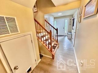 5 Saxton Road Farmingdale, NJ 07727 - Photo 10 of 39 a view of an entryway with staircase
