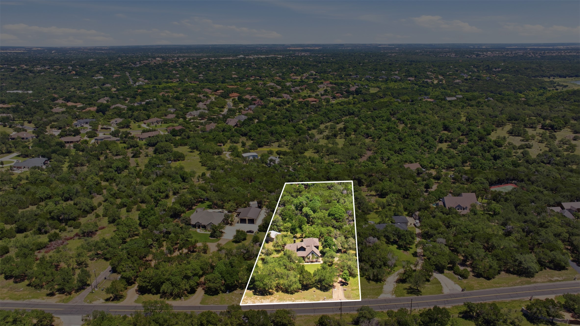 1301 County Road 262 Georgetown, TX 78633 - Photo 6 of 39 Aerial perspective showcasing a single-family residence situated within a treed landscape