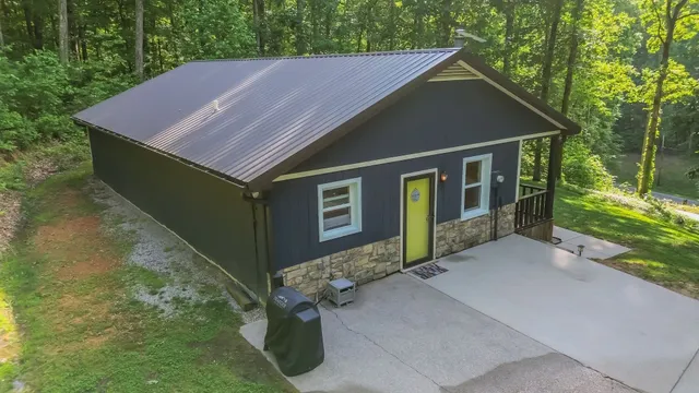 a aerial view of a house with a yard