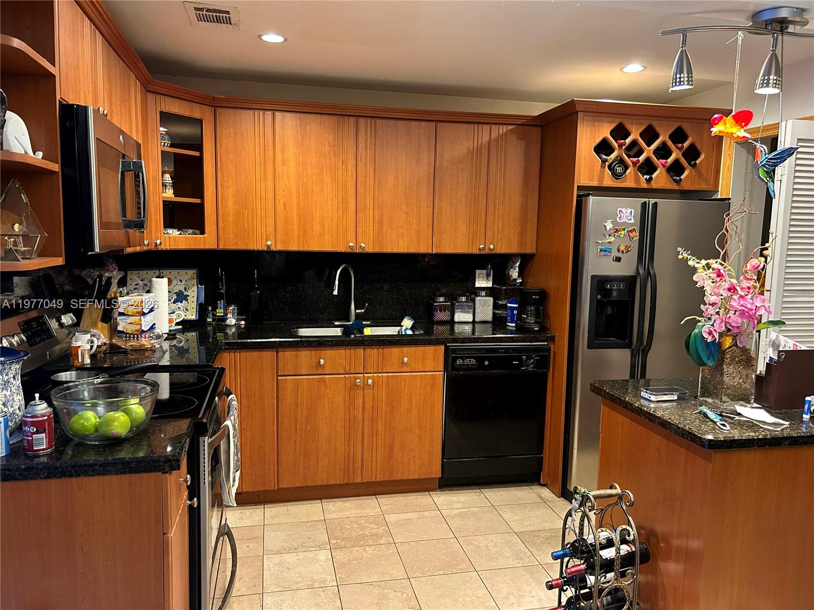 11219 Southwest 33 Rd Circle Place Brooklyn, FL 11219 - Photo 1 of 17 a kitchen with stainless steel appliances granite countertop a refrigerator and a stove