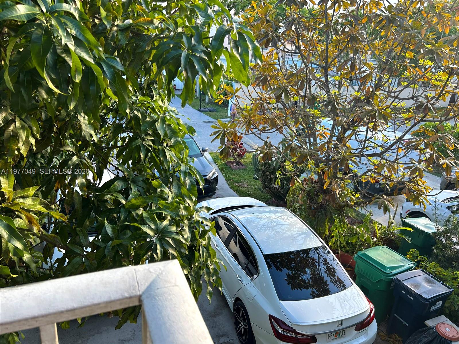 11219 Southwest 33 Rd Circle Place Brooklyn, FL 11219 - Photo 15 of 17 a balcony with table and chairs