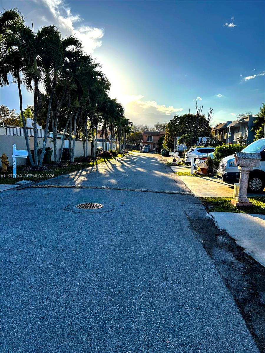 11219 Southwest 33 Rd Circle Place Brooklyn, FL 11219 - Photo 17 of 17 a view of a swimming pool with an outdoor space and seating area