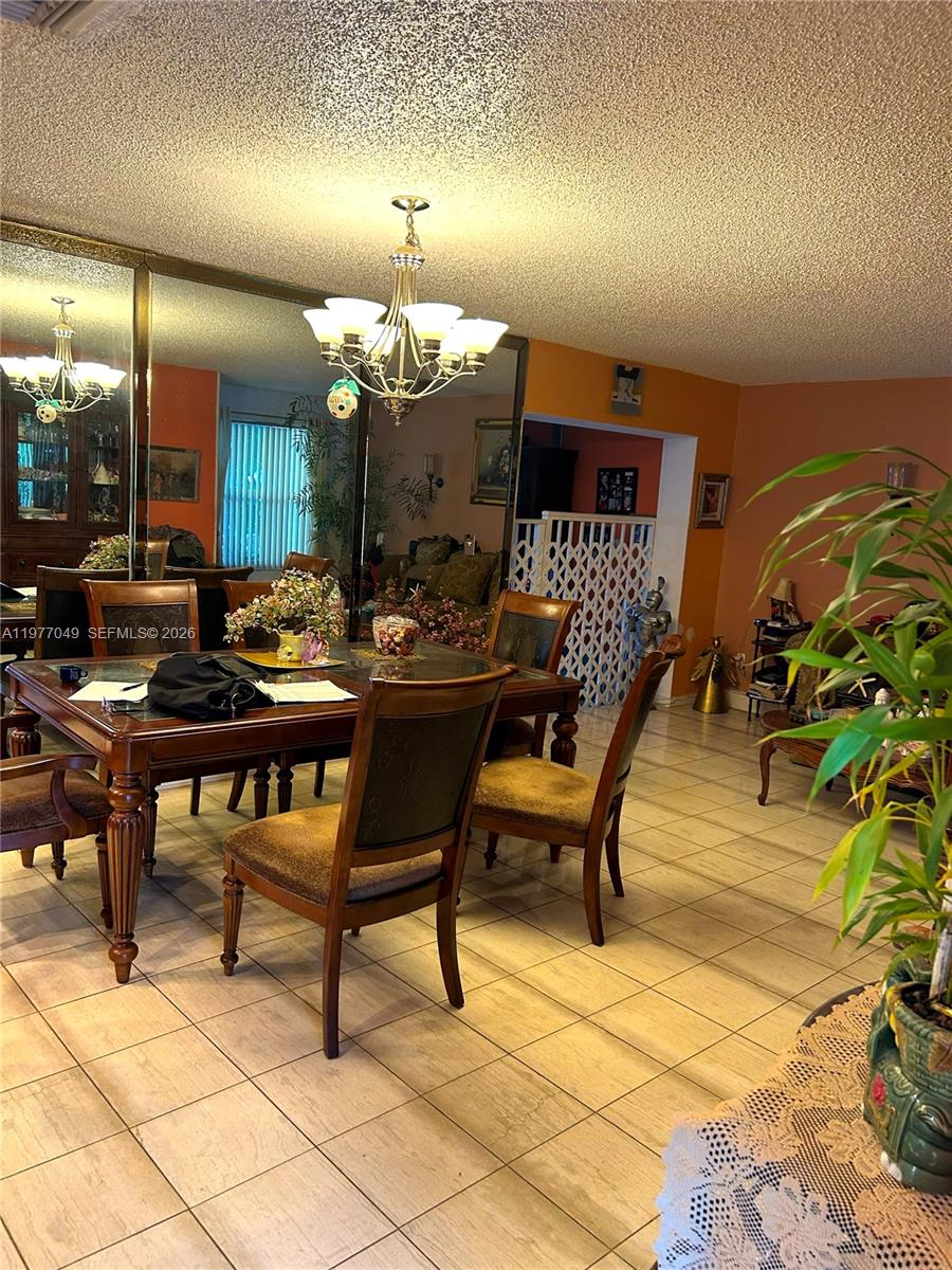 11219 Southwest 33 Rd Circle Place Brooklyn, FL 11219 - Photo 3 of 17 a outdoor space with lots of furniture and a potted plant