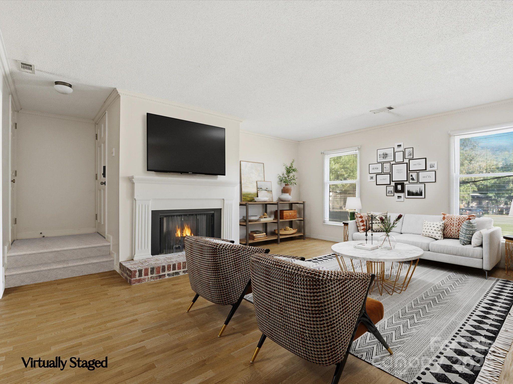1784 Ebenezer Road, Unit C Rock Hill, SC 29732 - Photo 3 of 9 a living room with fireplace furniture and a flat screen tv