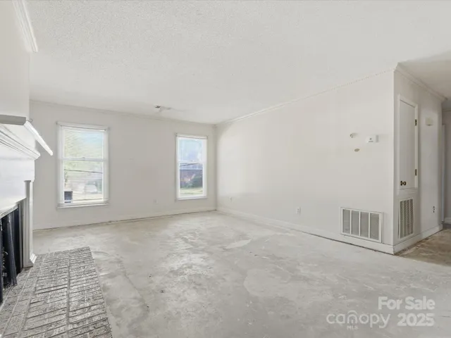 an empty room with windows