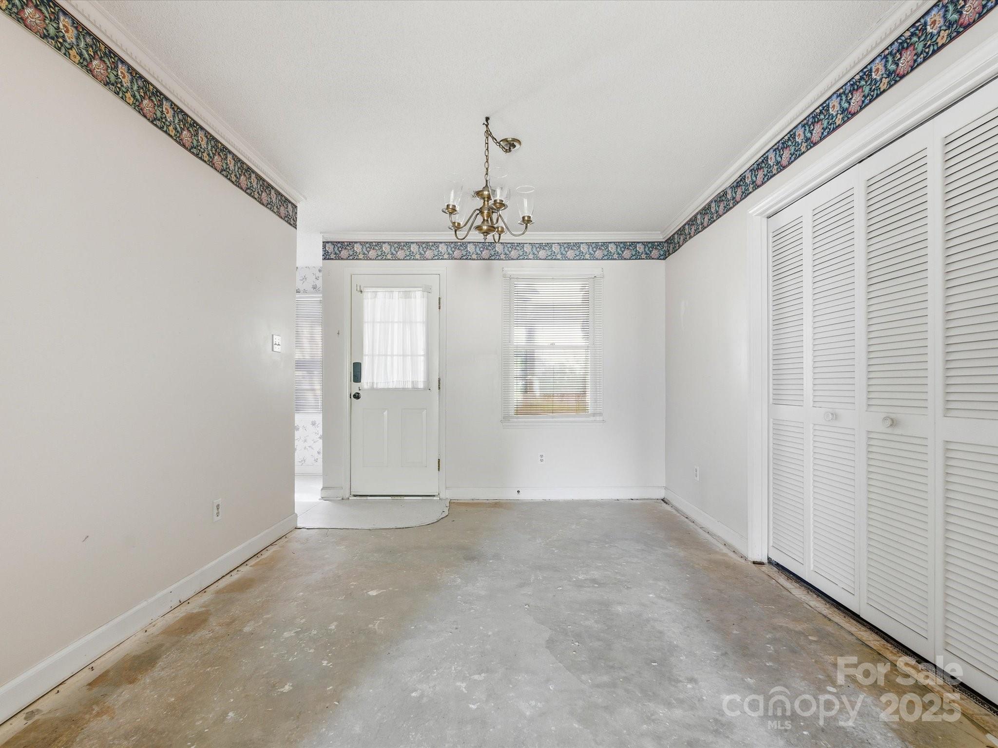 1784 Ebenezer Road, Unit C Rock Hill, SC 29732 - Photo 8 of 9 a view of a big room with chandelier and windows