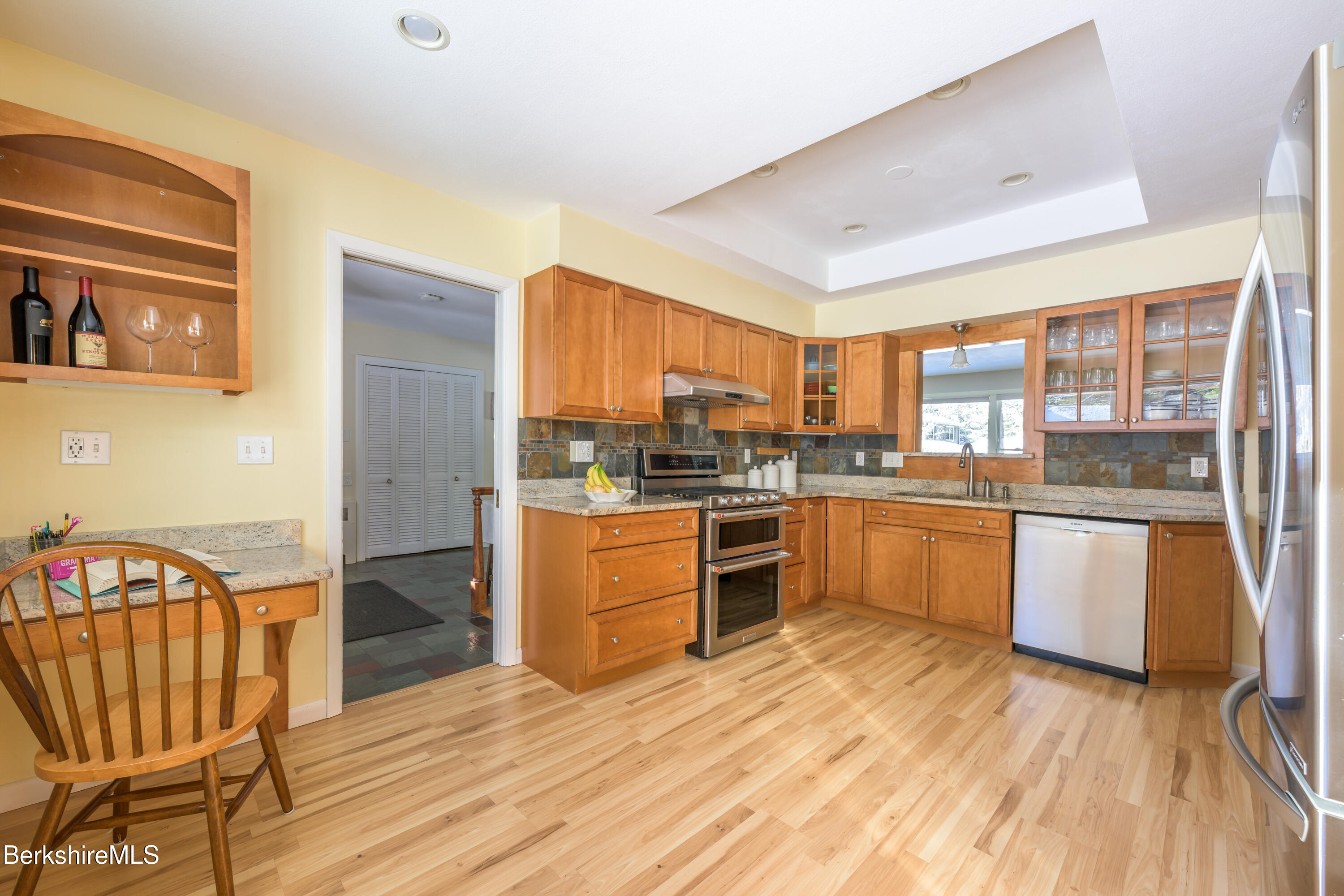40 Leroi Drive Pittsfield, MA 01201 - Photo 12 of 38 a kitchen with stainless steel appliances granite countertop a refrigerator a stove top oven and a sink with granite countertops