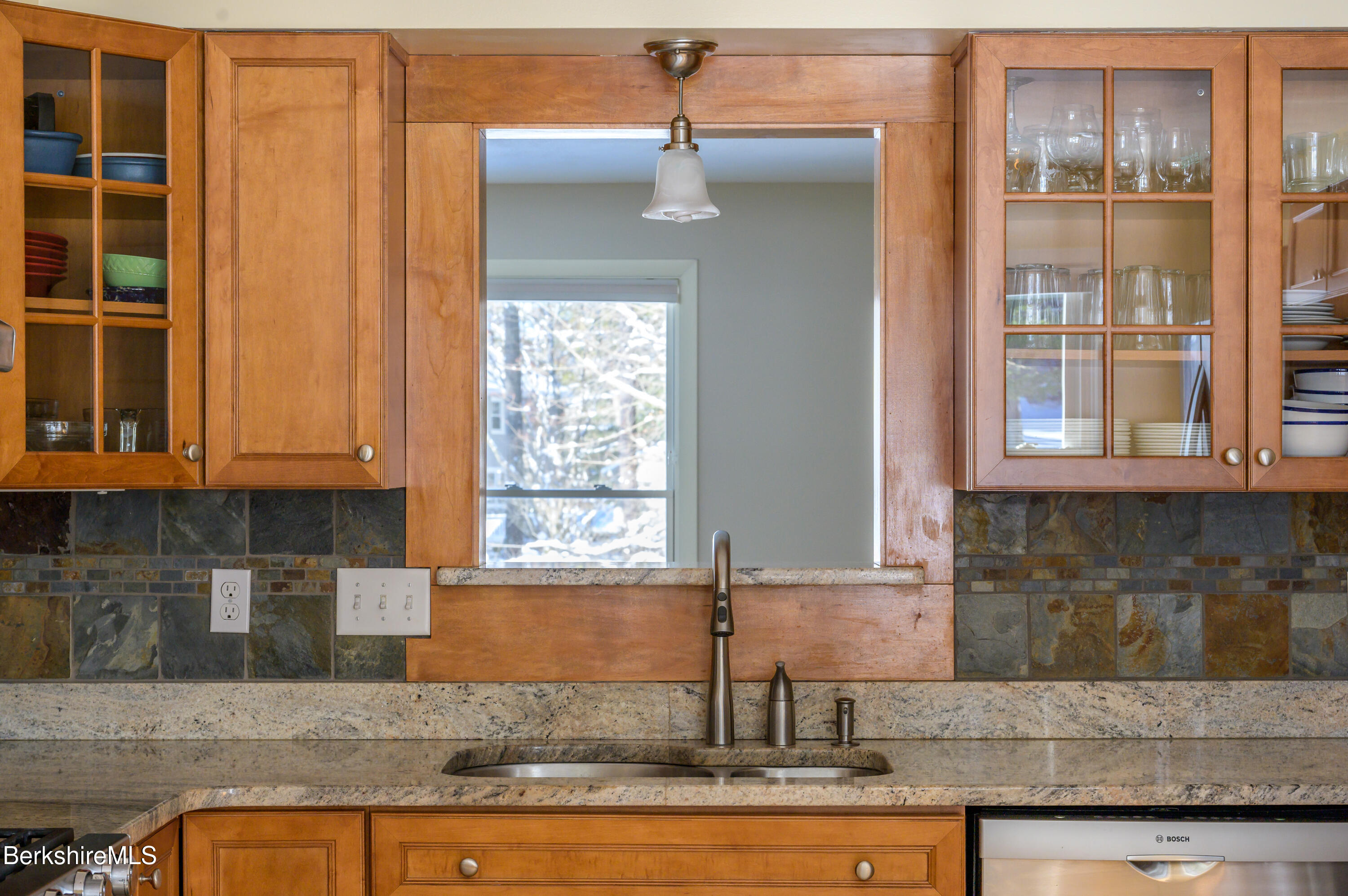 40 Leroi Drive Pittsfield, MA 01201 - Photo 14 of 38 a kitchen with granite countertop a stove and cabinets