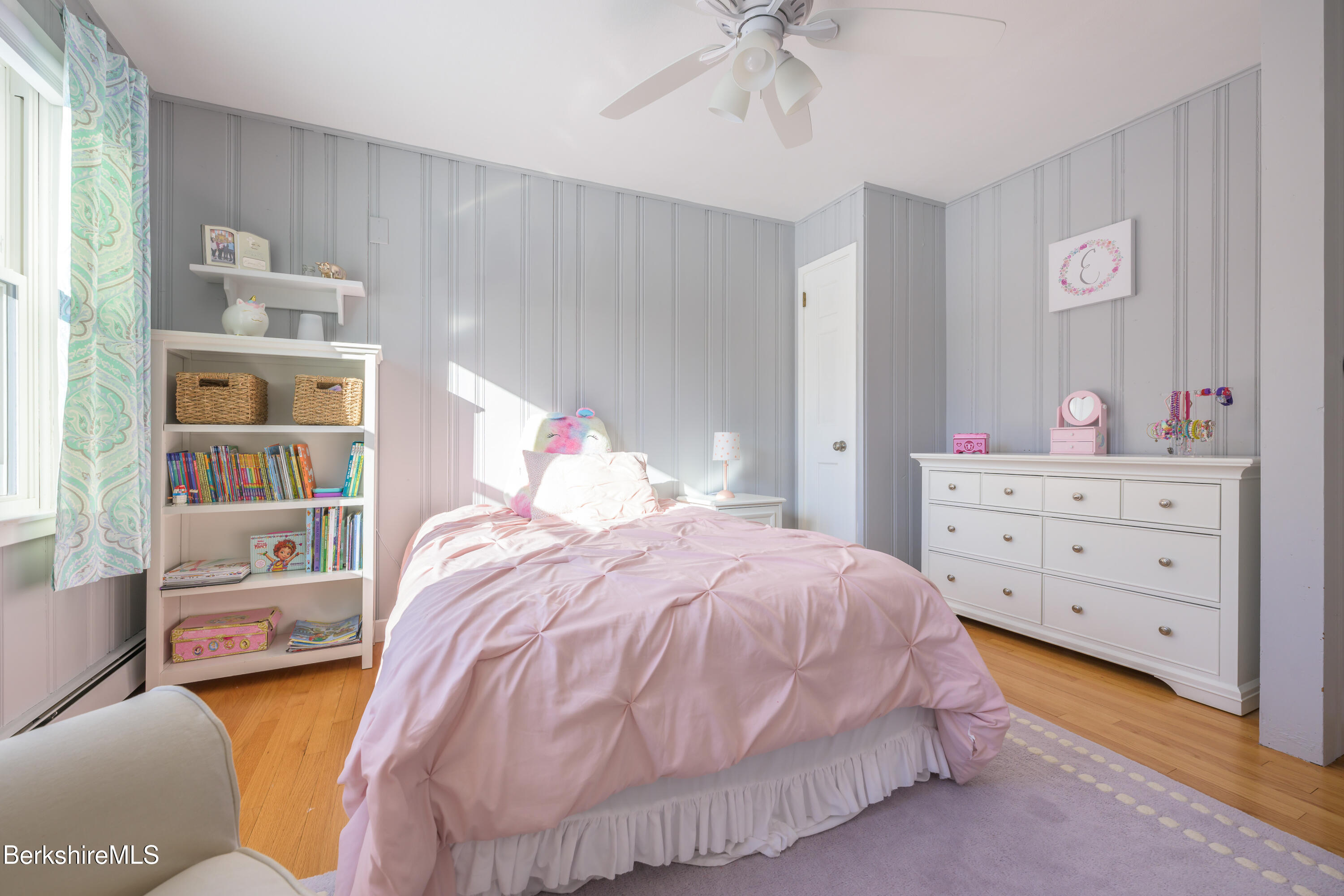 40 Leroi Drive Pittsfield, MA 01201 - Photo 24 of 38 a bedroom with a bed and a book shelf