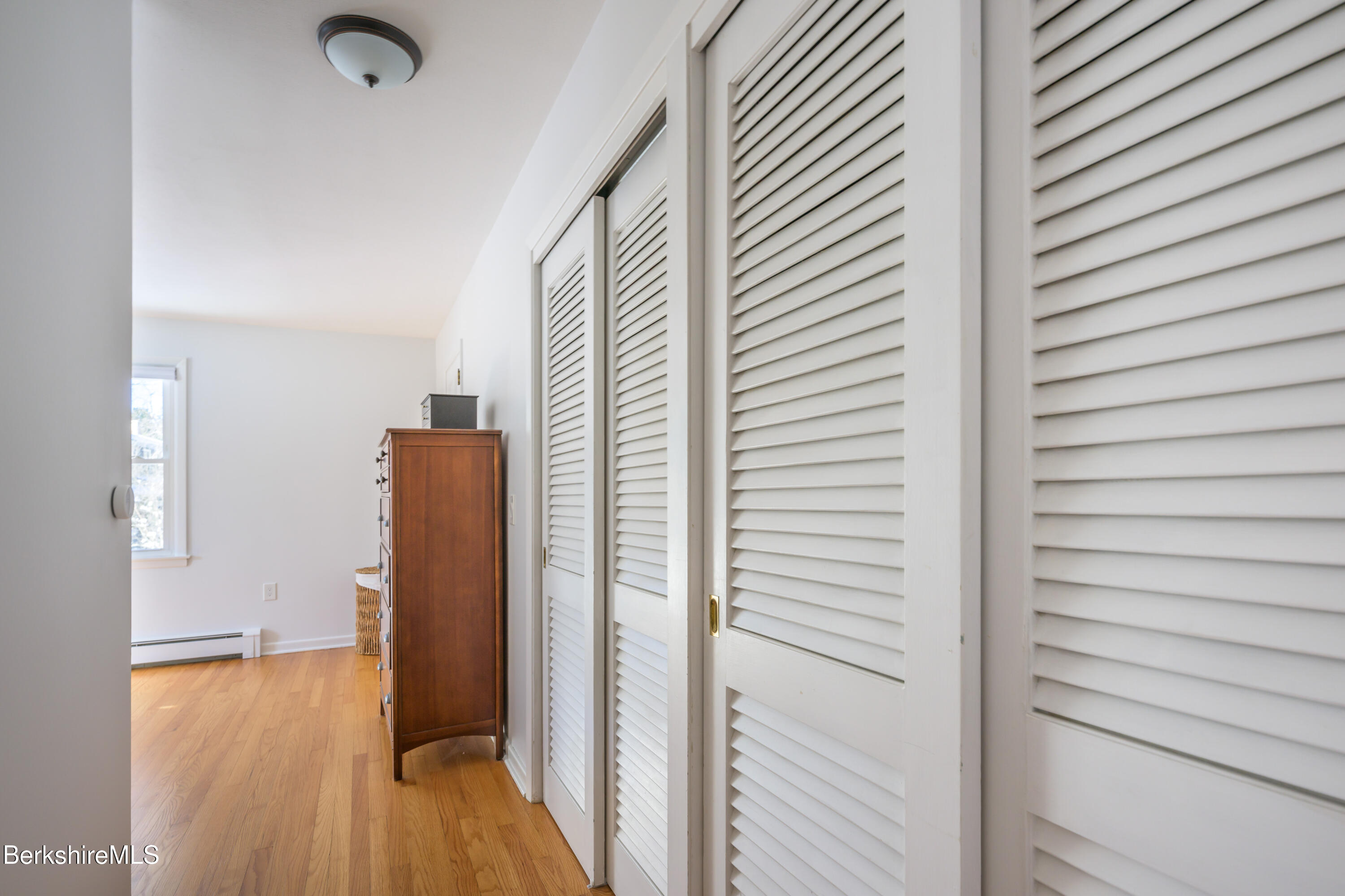 40 Leroi Drive Pittsfield, MA 01201 - Photo 25 of 38 a view of a hallway with wooden floor and staircase