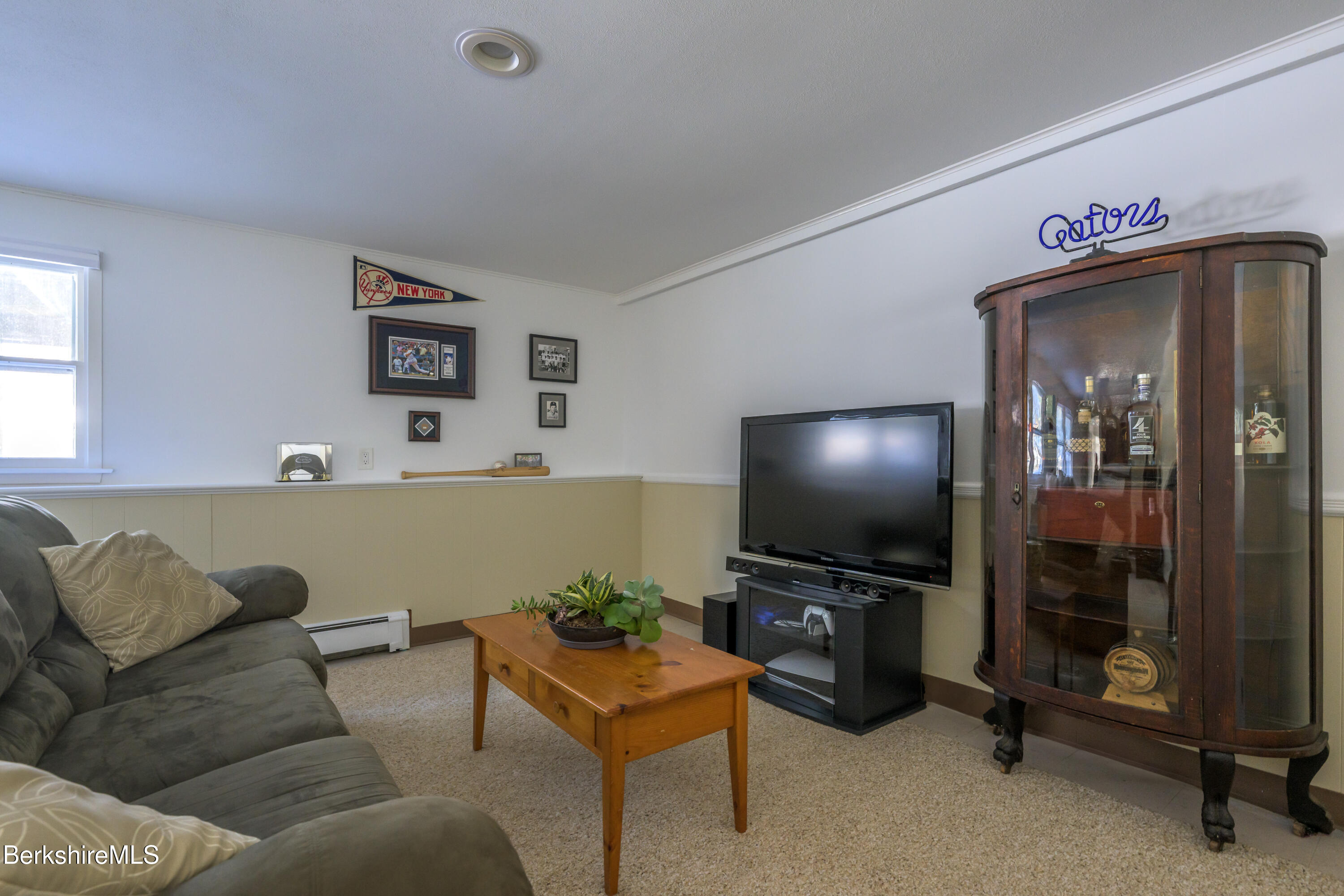 40 Leroi Drive Pittsfield, MA 01201 - Photo 32 of 38 a living room with furniture and a flat screen tv