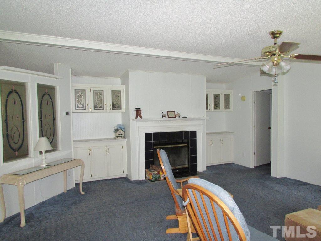 4128 Allensville Road Roxboro, NC 27574 - Photo 2 of 24 a bedroom with furniture and a fireplace