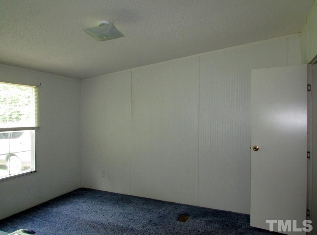 4128 Allensville Road Roxboro, NC 27574 - Photo 12 of 24 an empty room with a window