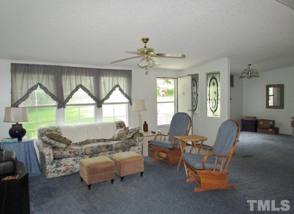 4128 Allensville Road Roxboro, NC 27574 - Photo 3 of 24 a living room with furniture and a window
