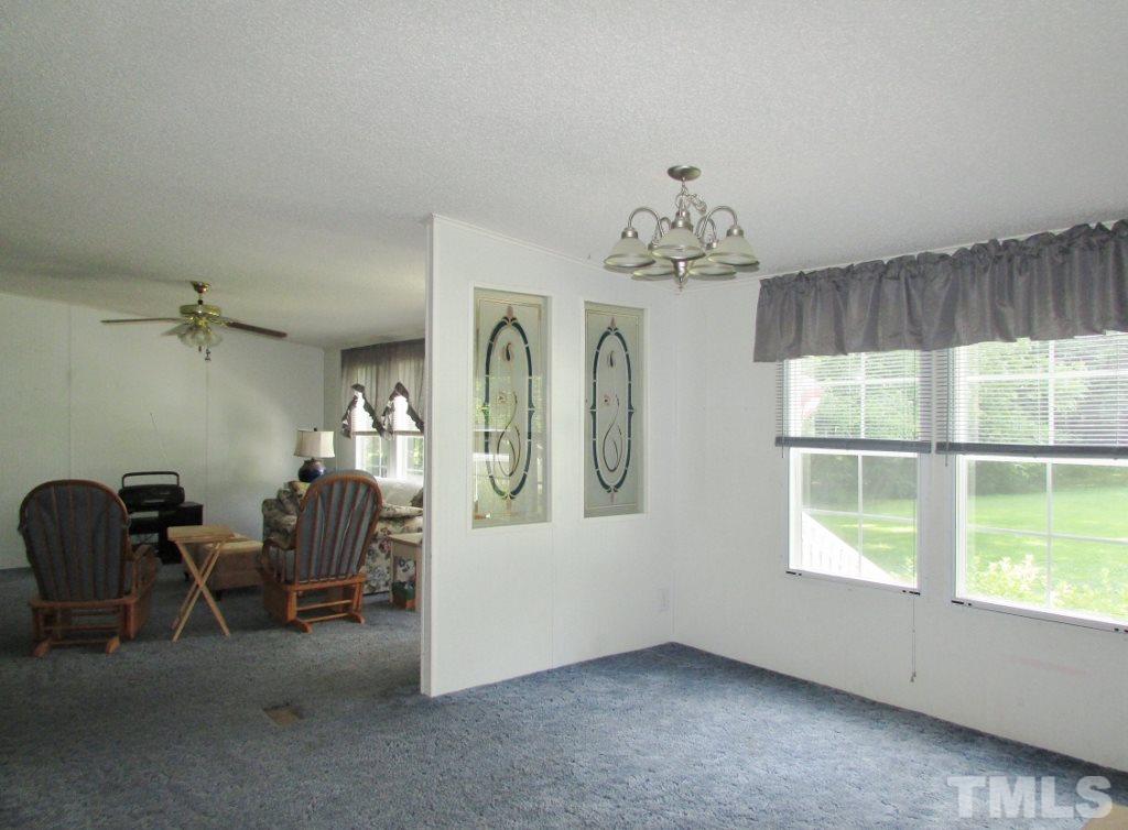 4128 Allensville Road Roxboro, NC 27574 - Photo 4 of 24 a view of a livingroom with furniture window and wooden floor