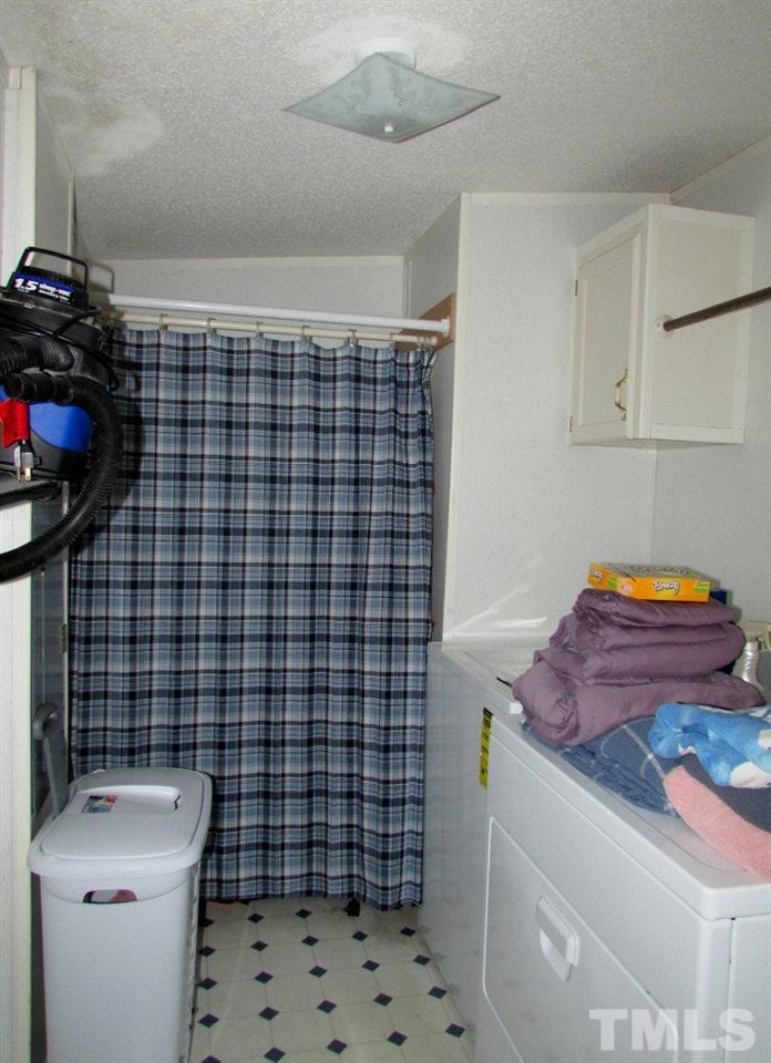 4128 Allensville Road Roxboro, NC 27574 - Photo 8 of 24 a bathroom with a sink toilet and shower