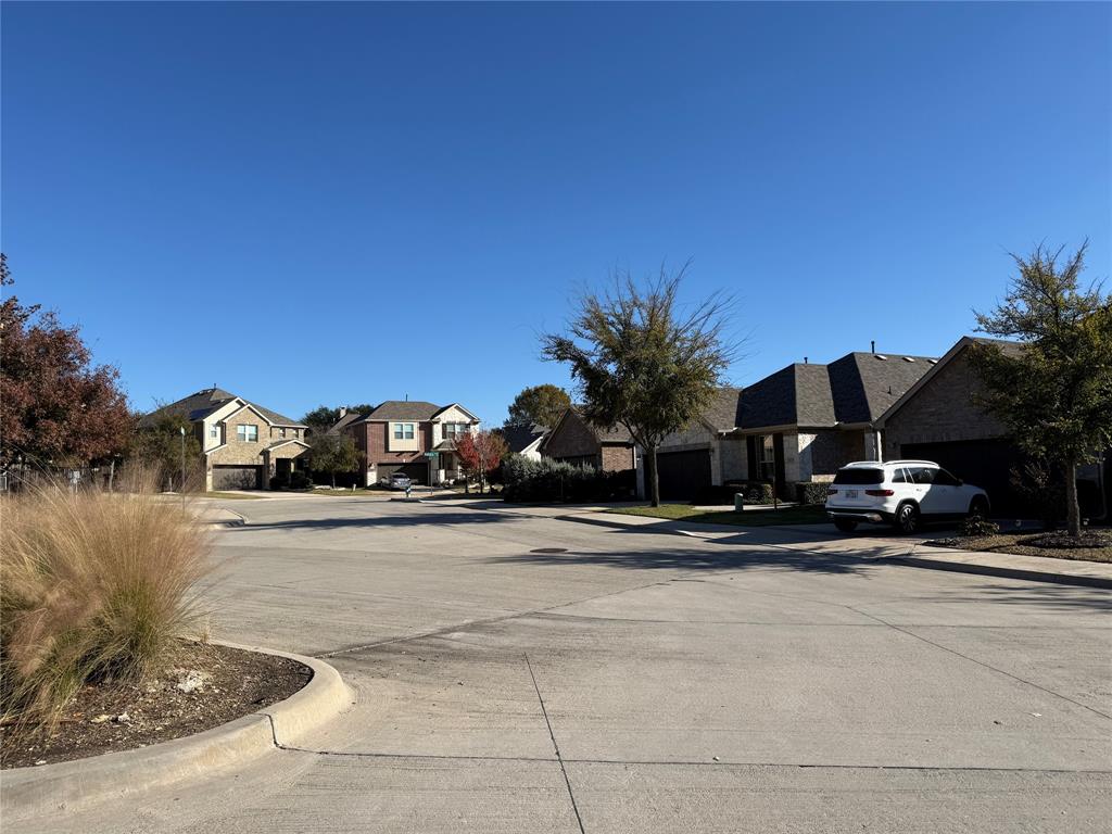 8089 Rabbit Drive Frisco, TX 75034 - Photo 9 of 37 View of concrete street with a residential view and curbs