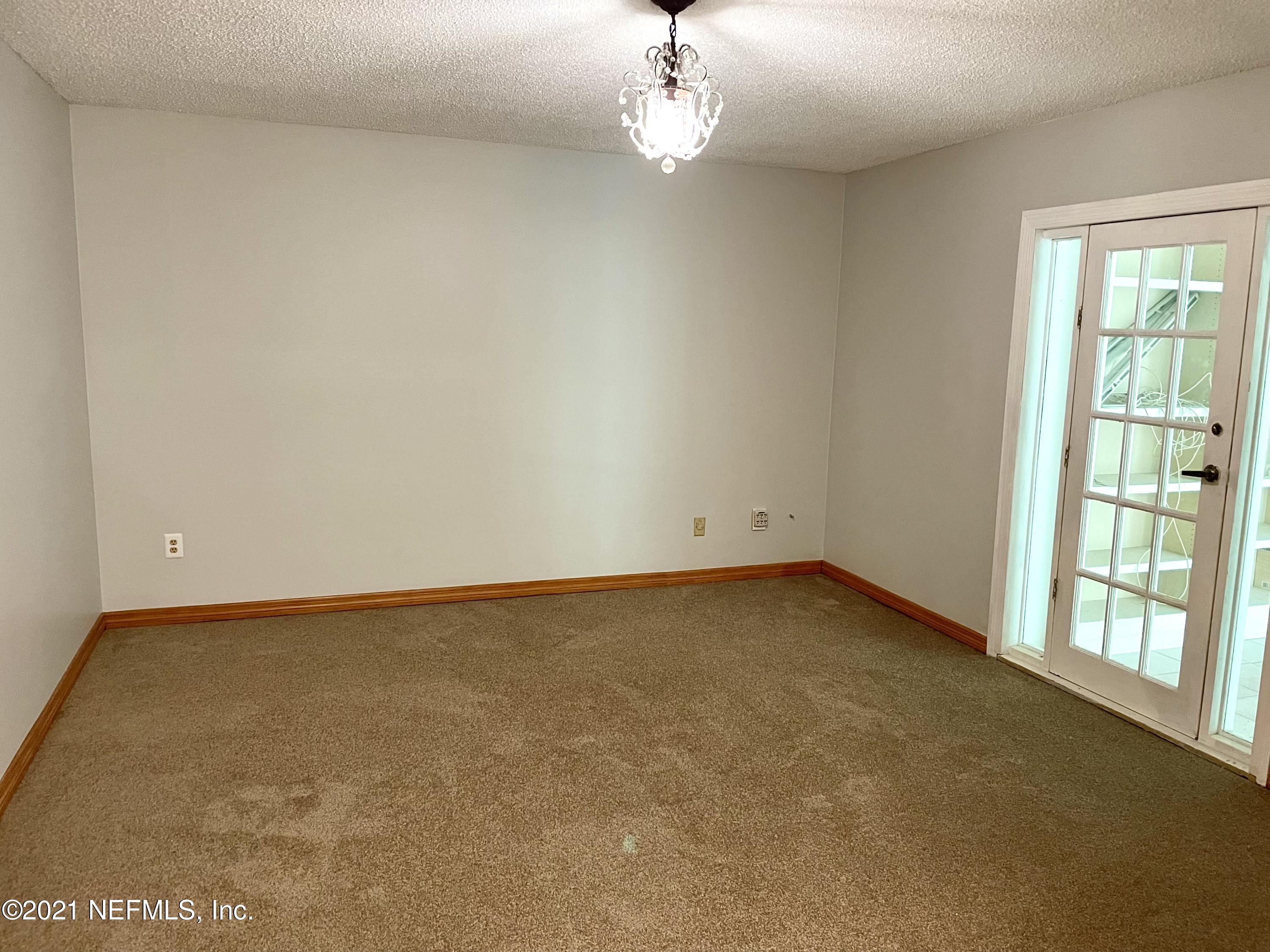 536 Segovia Road St. Augustine, FL 32086 - Photo 9 of 20 wooden floor in an empty room with a window