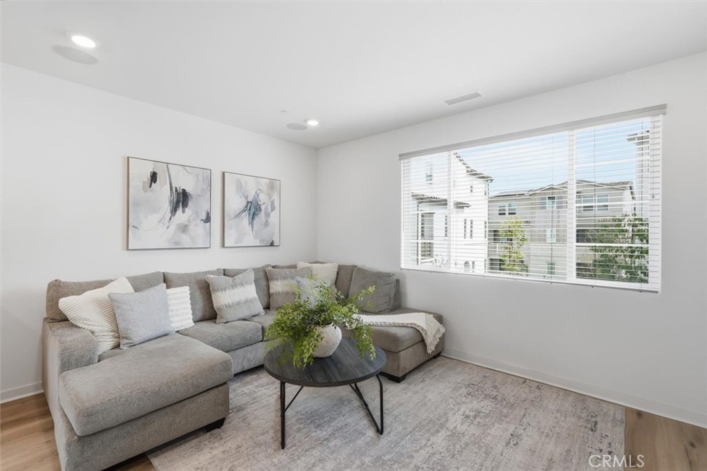 361 Gelding Way Rancho Mission Viejo, CA 92694 - Photo 16 of 59 a living room with furniture and a large window
