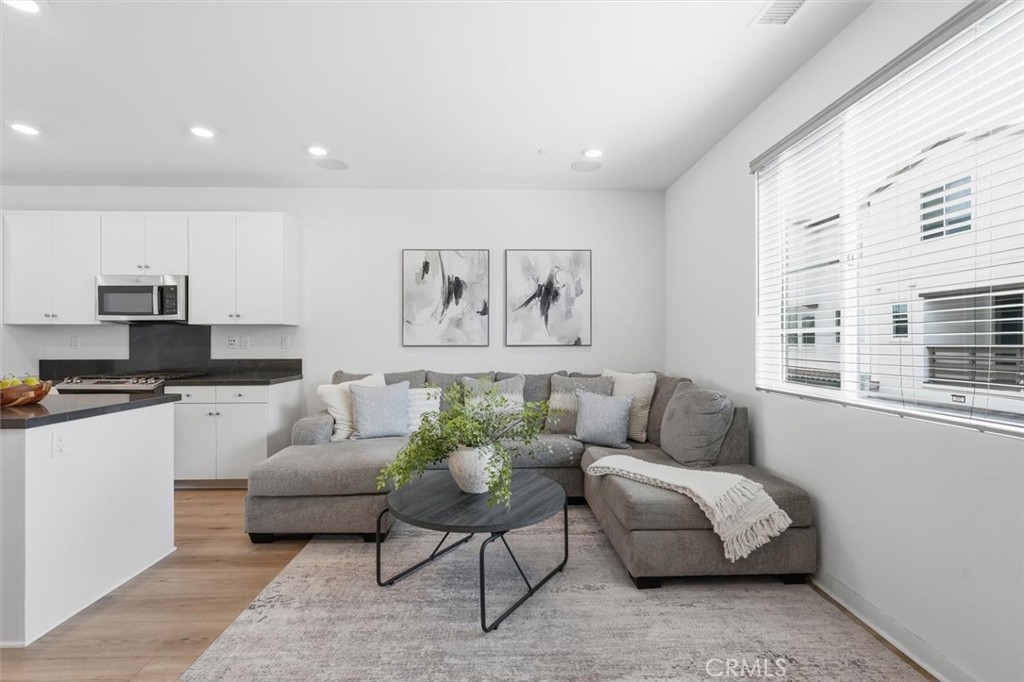 361 Gelding Way Rancho Mission Viejo, CA 92694 - Photo 17 of 59 a living room with furniture and a large window