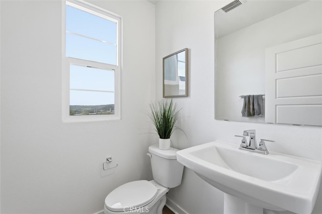 361 Gelding Way Rancho Mission Viejo, CA 92694 - Photo 31 of 59 a bathroom with a sink mirror and toilet