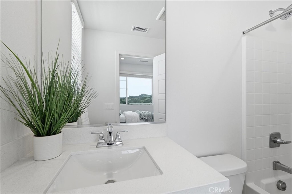 361 Gelding Way Rancho Mission Viejo, CA 92694 - Photo 36 of 59 a bathroom with a sink a toilet and tub