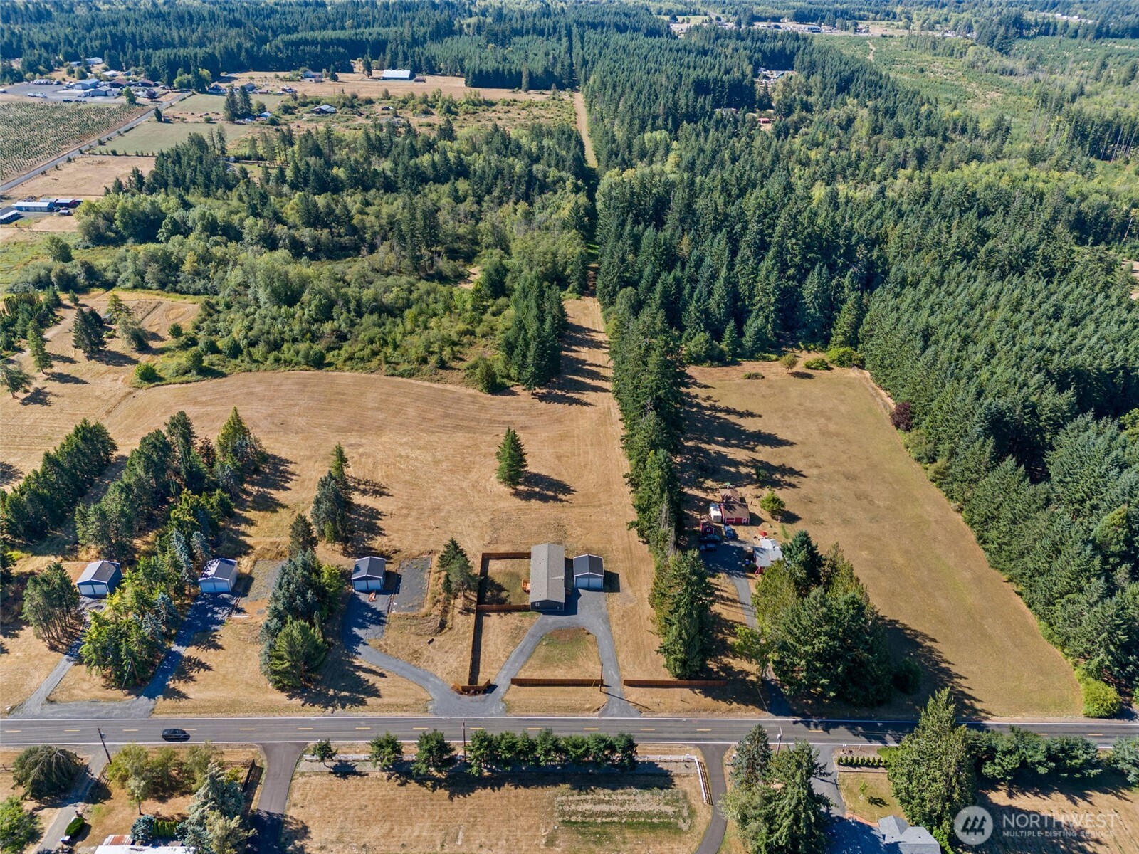 1088 Koontz Road Napavine, WA 98532 - Photo 33 of 36 an aerial view of a house with a yard and lake view