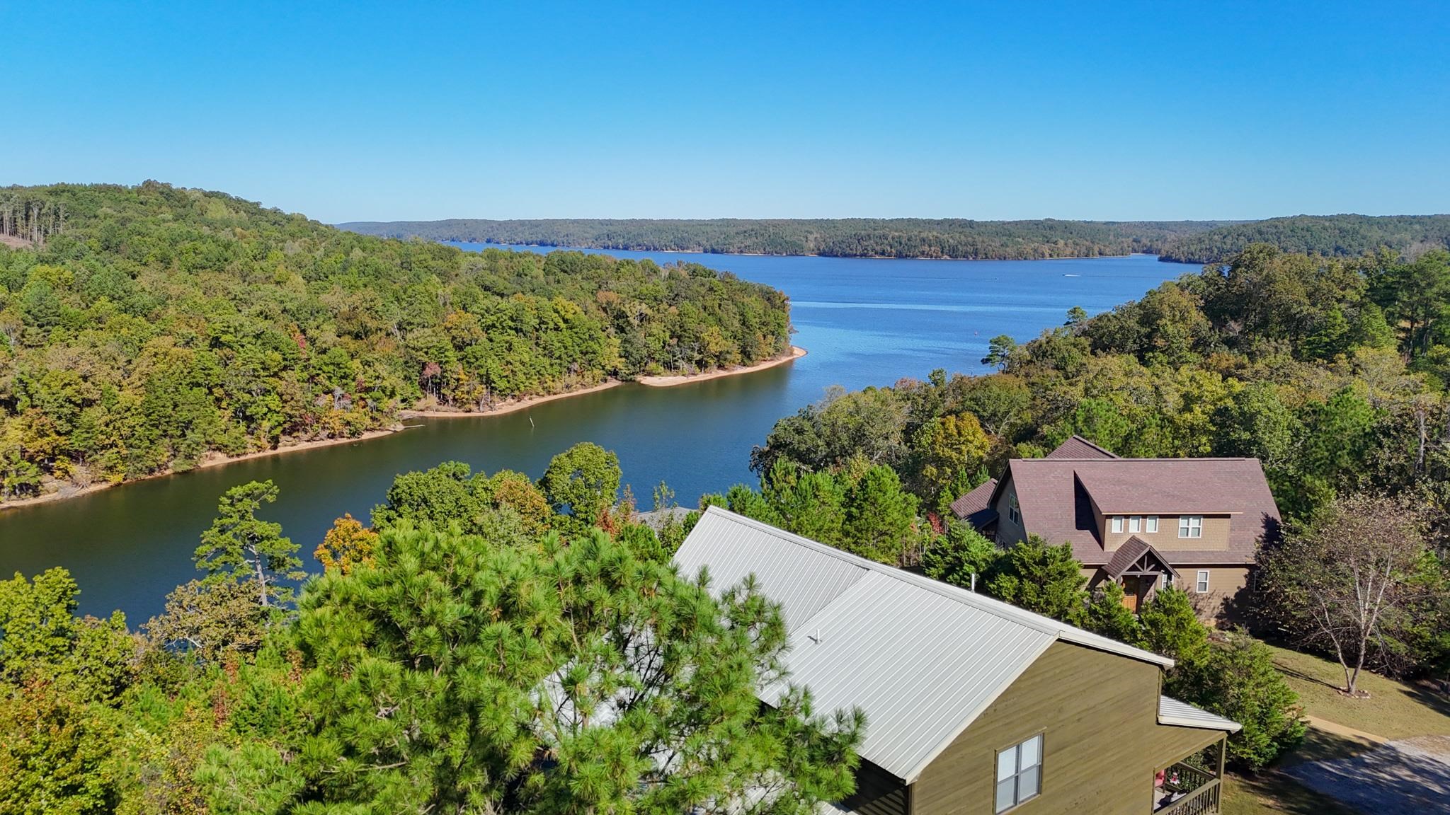 an aerial view of a house with a lake view
