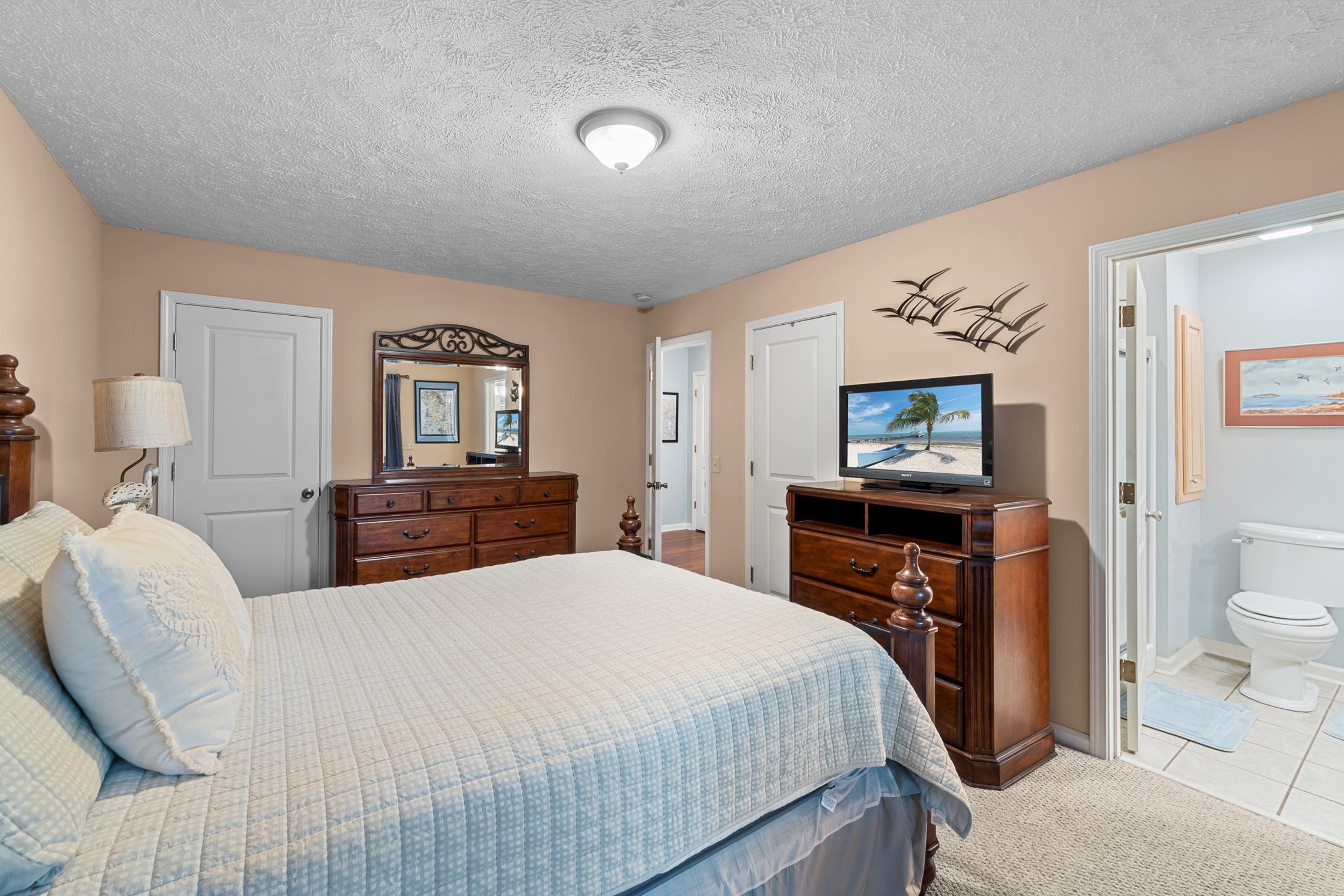 15 Marina Point Circle Iuka, MS 38852 - Photo 11 of 24 a bedroom with a bed and a flat screen tv