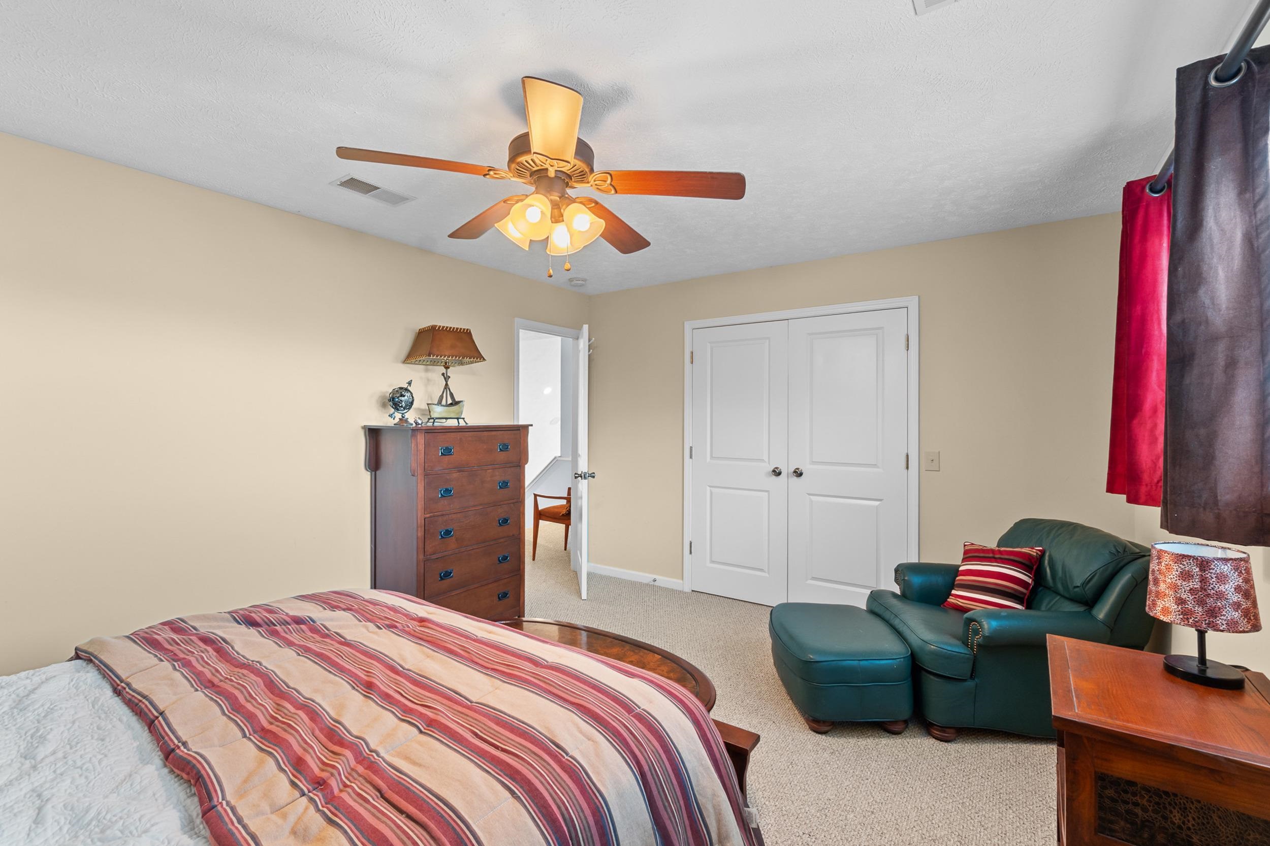 15 Marina Point Circle Iuka, MS 38852 - Photo 14 of 24 a bedroom with a bed and a chandelier