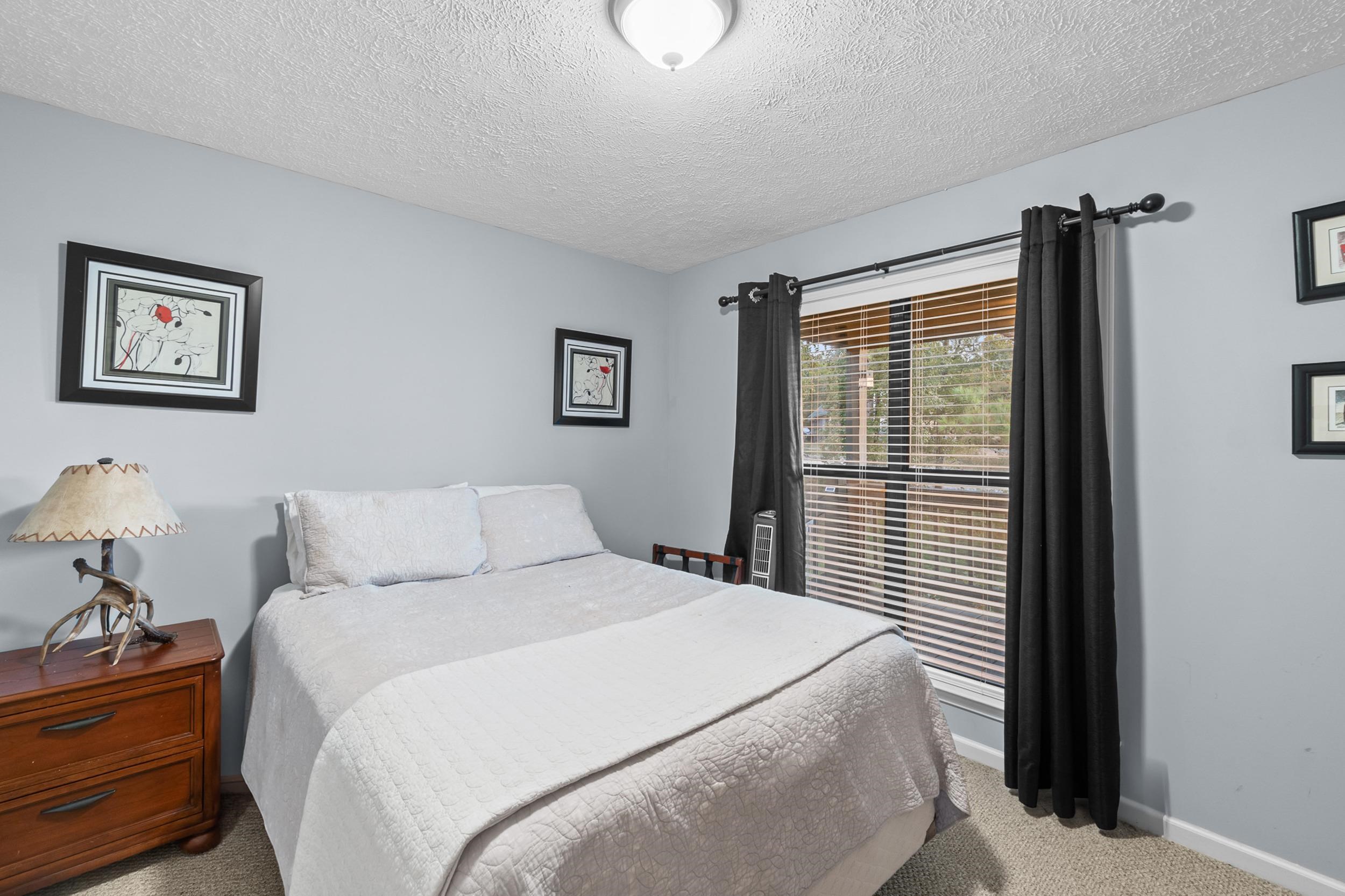 15 Marina Point Circle Iuka, MS 38852 - Photo 16 of 24 a bedroom with a bed and a window