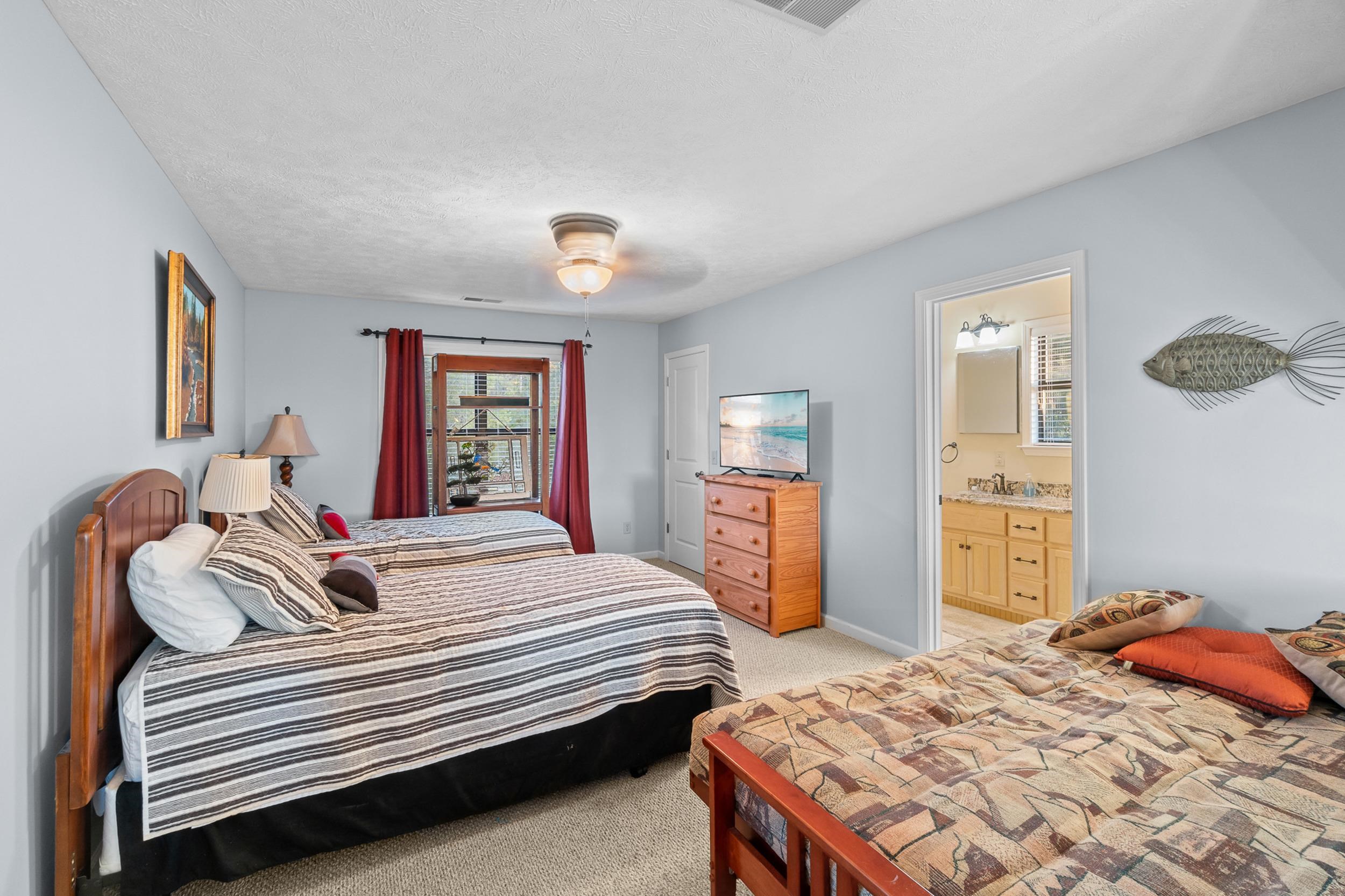 15 Marina Point Circle Iuka, MS 38852 - Photo 21 of 24 a bedroom with a bed and dresser with mirror