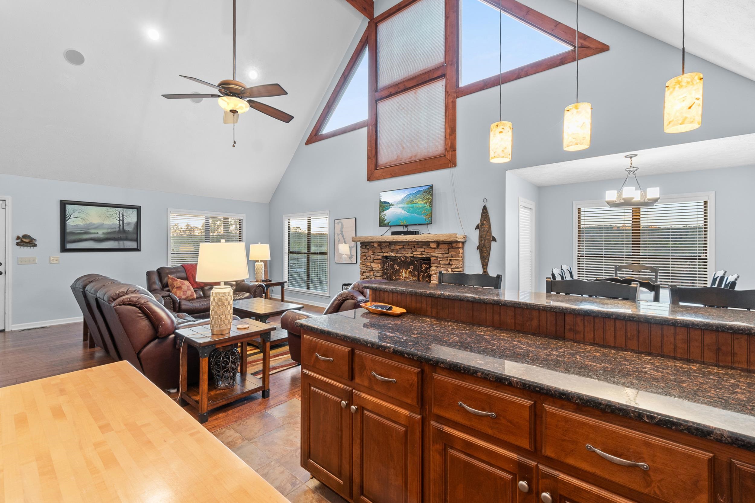 15 Marina Point Circle Iuka, MS 38852 - Photo 6 of 24 a living room with furniture a chandelier and a flat screen tv
