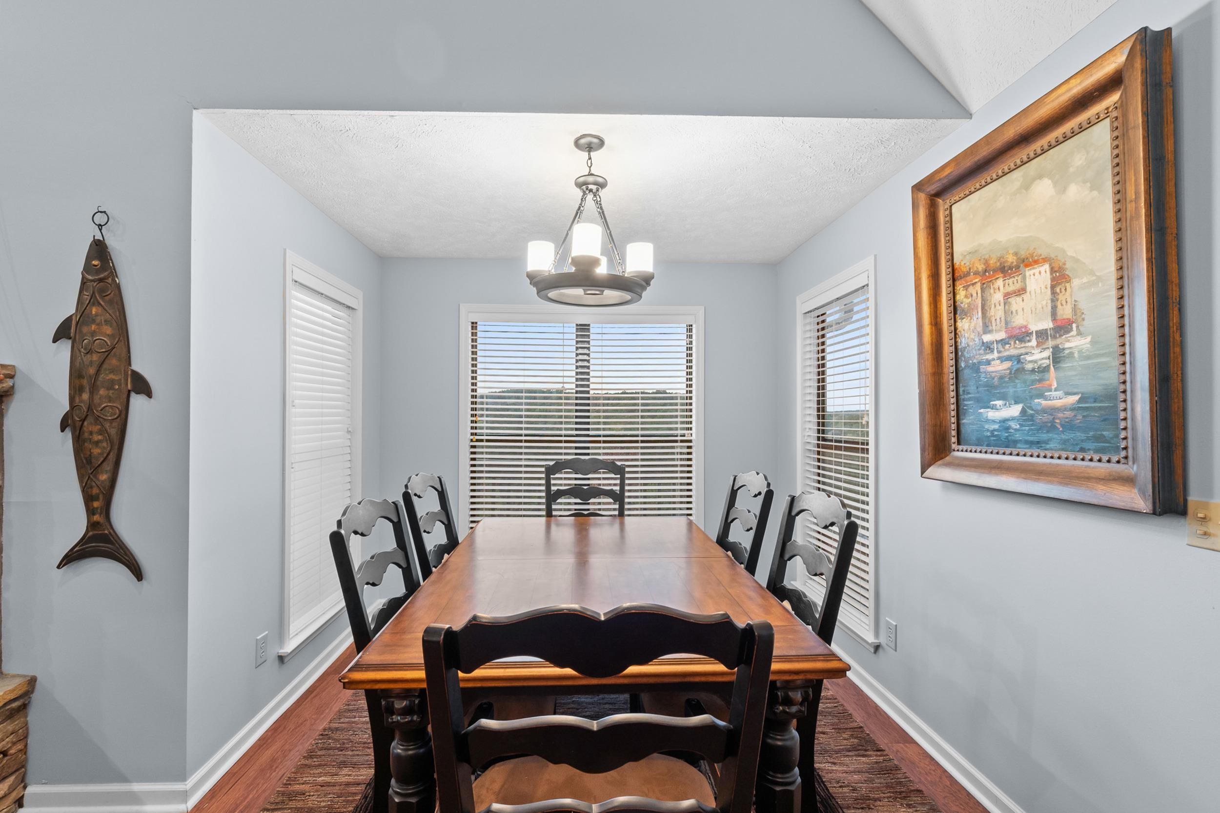 15 Marina Point Circle Iuka, MS 38852 - Photo 9 of 24 a dining room with furniture a chandelier and wooden floor