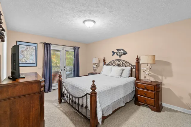 a bedroom with a bed and a table