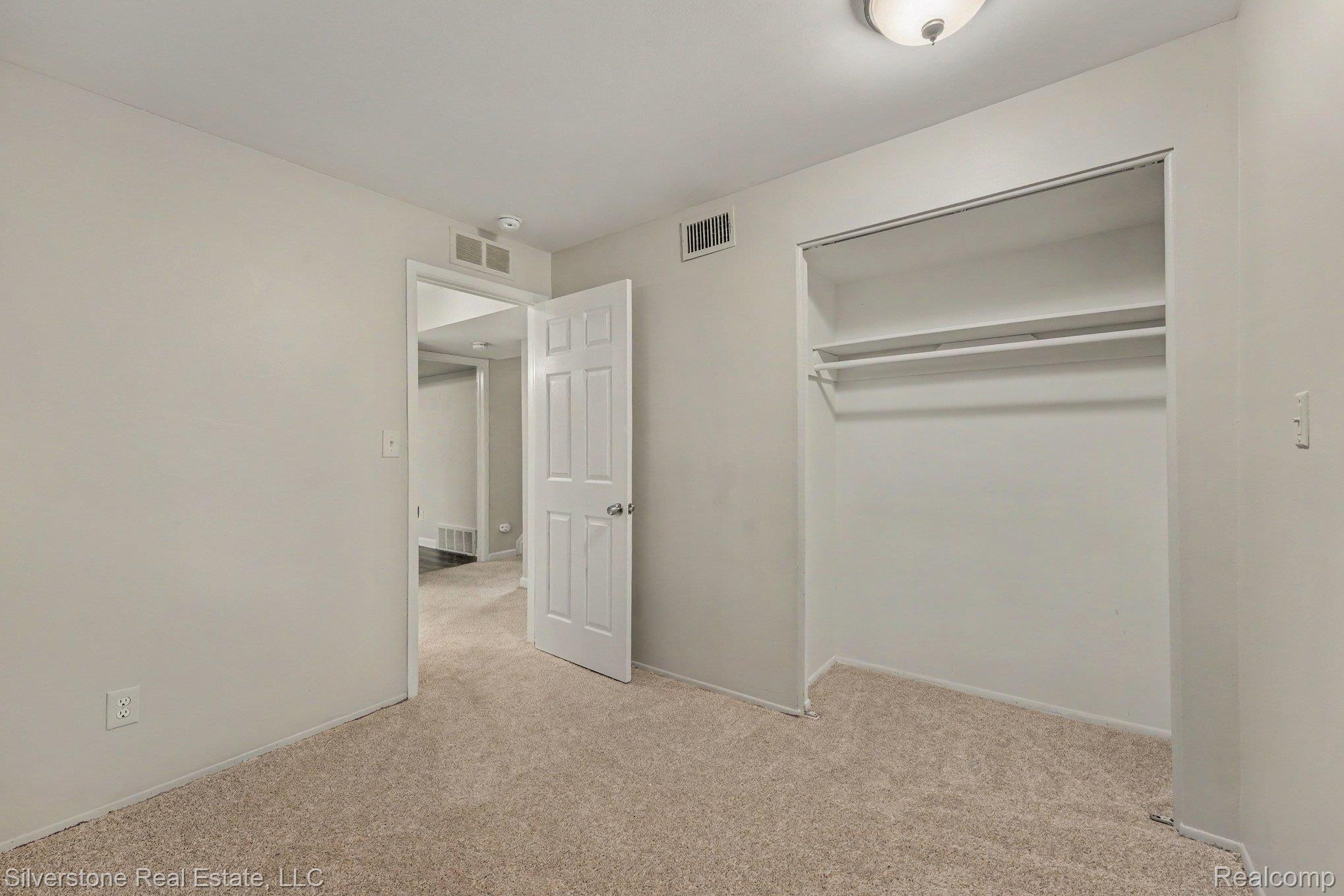 547 Reed Street Northville, MI 48167 - Photo 22 of 38 Neutral-toned carpeting and walls provide a versatile backdrop