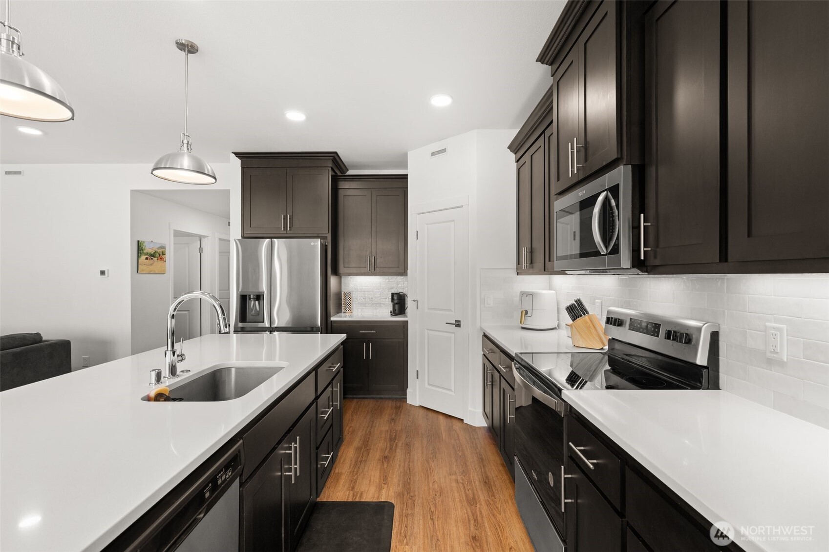 501 Pagget Avenue Winlock, WA 98596 - Photo 11 of 30 a kitchen with a sink stove and refrigerator