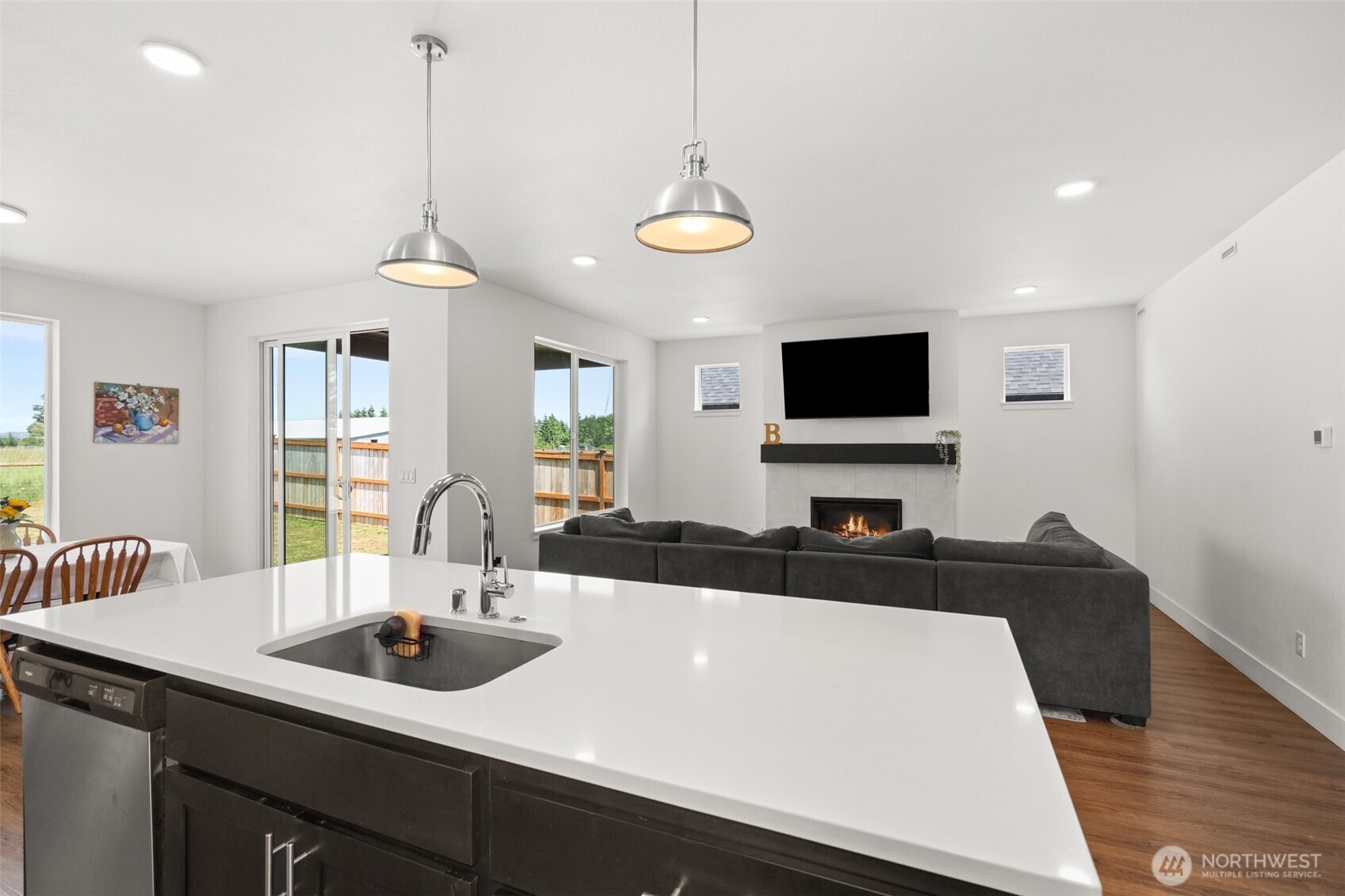 501 Pagget Avenue Winlock, WA 98596 - Photo 12 of 30 a view of a dining room and a flat screen tv