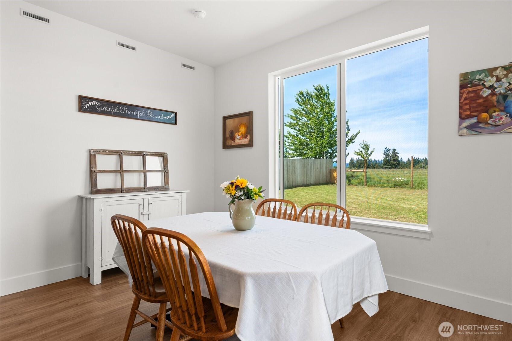 501 Pagget Avenue Winlock, WA 98596 - Photo 13 of 30 a view of a dining room with furniture window and wooden floor