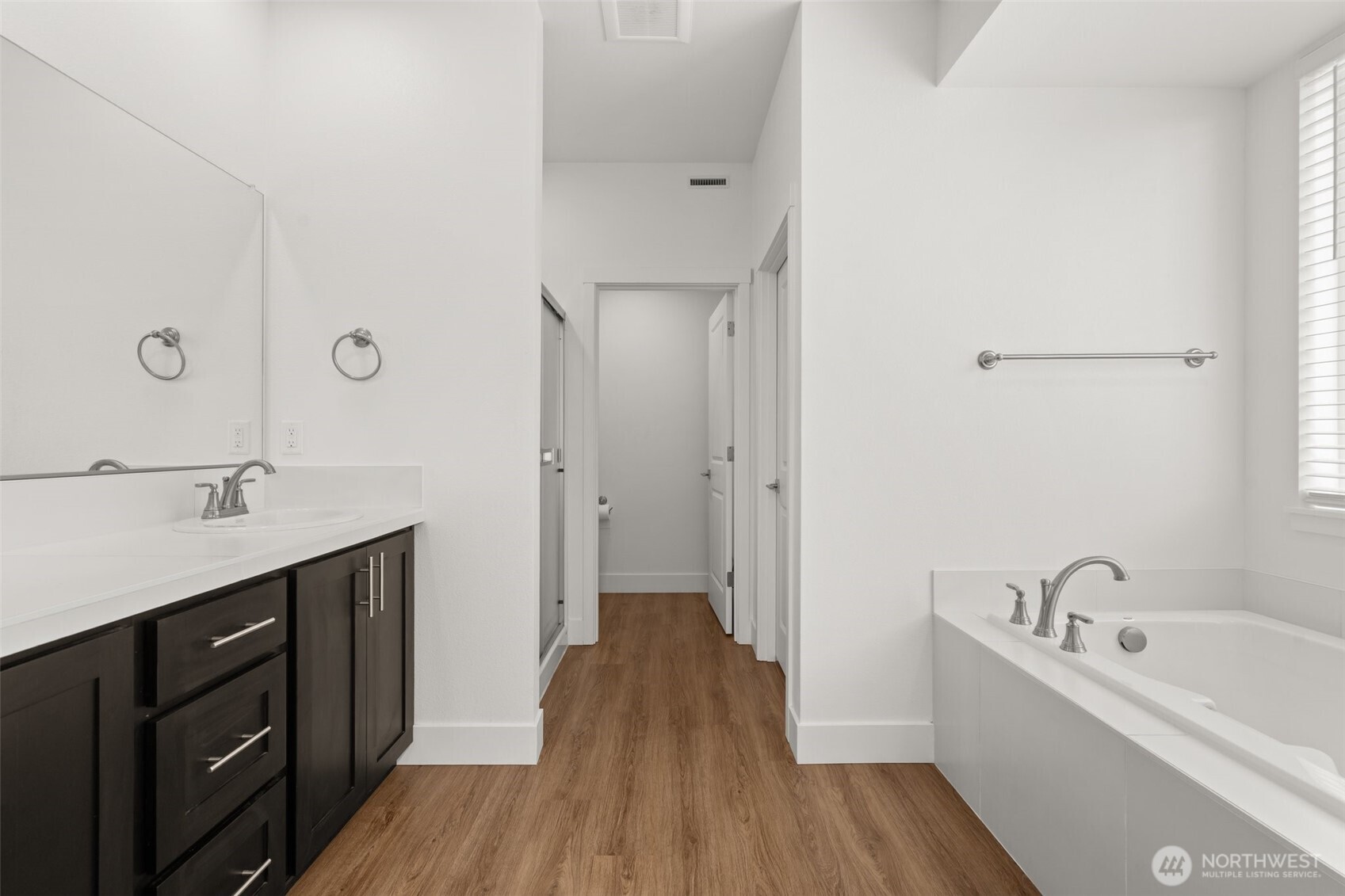 501 Pagget Avenue Winlock, WA 98596 - Photo 16 of 30 a kitchen with a sink and wooden floor