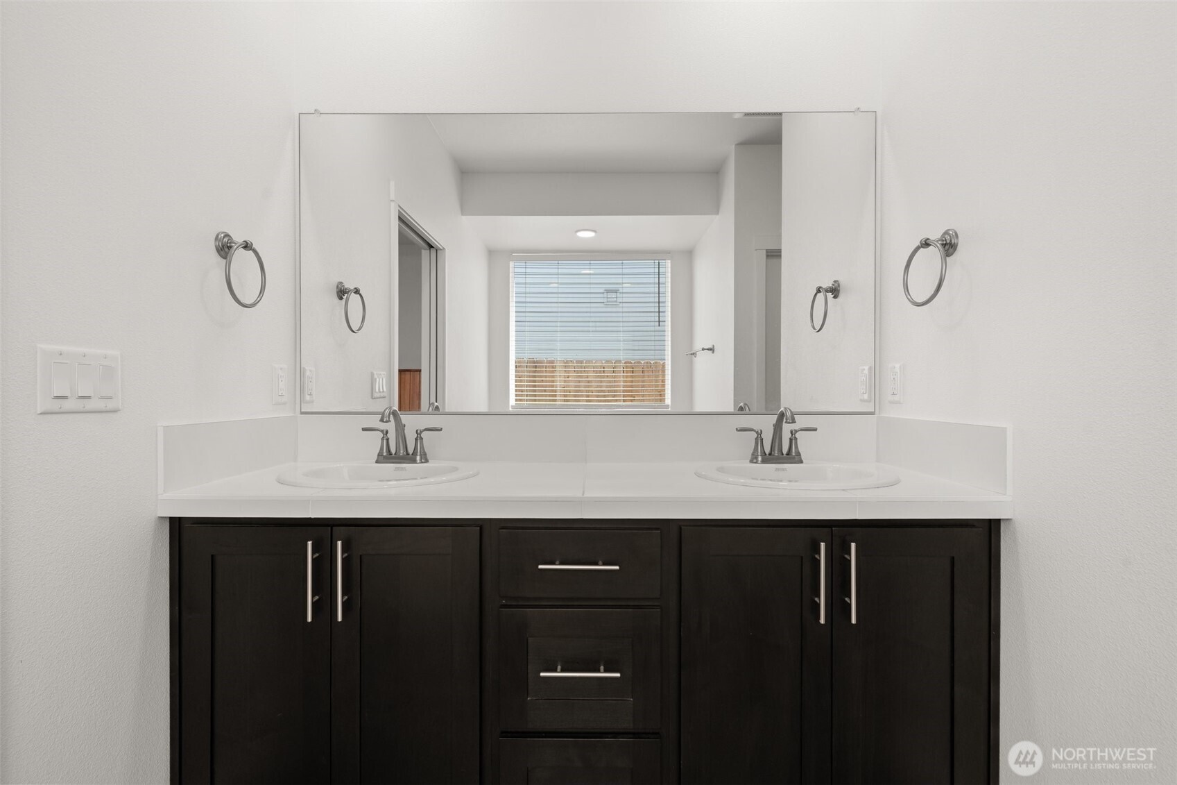 501 Pagget Avenue Winlock, WA 98596 - Photo 17 of 30 a bathroom with a double vanity sink and a mirror